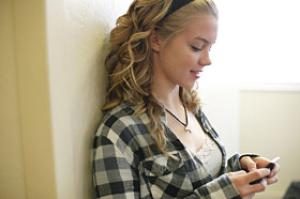 teen girl text messsaging at school